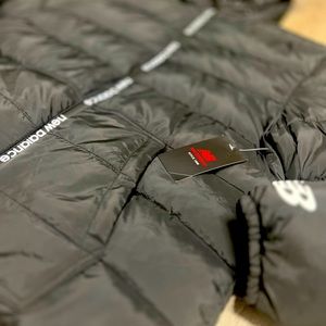 Stay warm and look good doing it. Black New Balance Puffer Jacket.